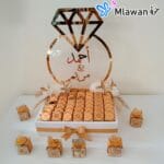 Golden acrylic mirror ring with diamond on chocolate box