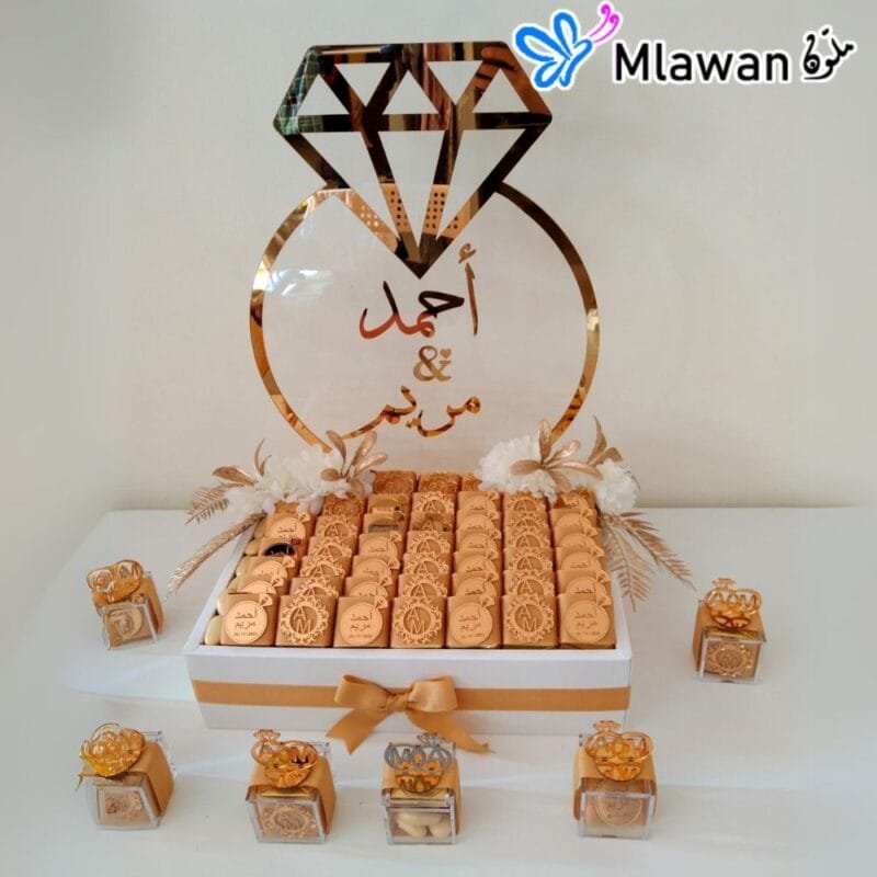 Golden acrylic mirror ring with diamond on chocolate box