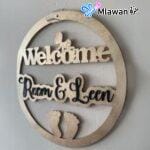 baby name door sign in black and gold