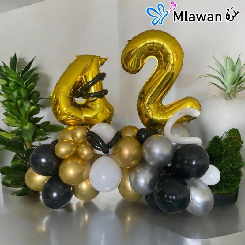 Black and gold number balloon decor for anniversaries
