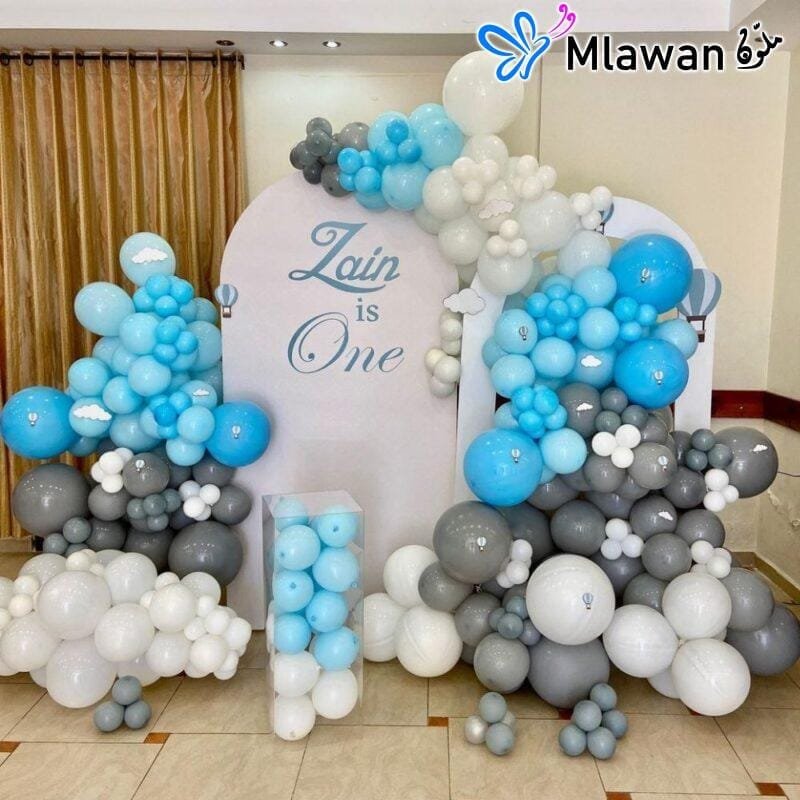 Balloon arch and backdrop for a first birthday celebration