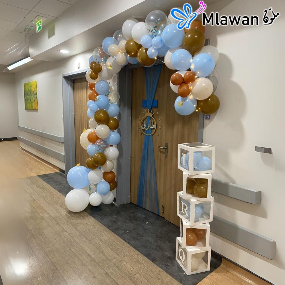 Newborn hospital room setup with balloon arch and baby name boxes Newborn hospital room setup with balloon arch and baby name boxes