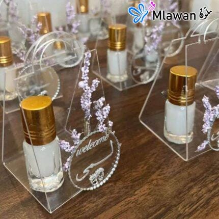 Engagement giveaways featuring musk perfume in decorative packaging