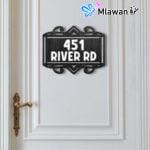 Wooden door plate with engraved house number.
