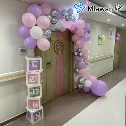 hospital room decoration service featuring balloon arches and door signs