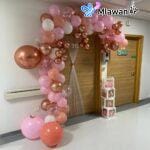 Customized door sign for hospital room featuring floral designs and soft pink themes