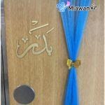 Personalized newborn announcement door decoration featuring baby blue chiffon drapes