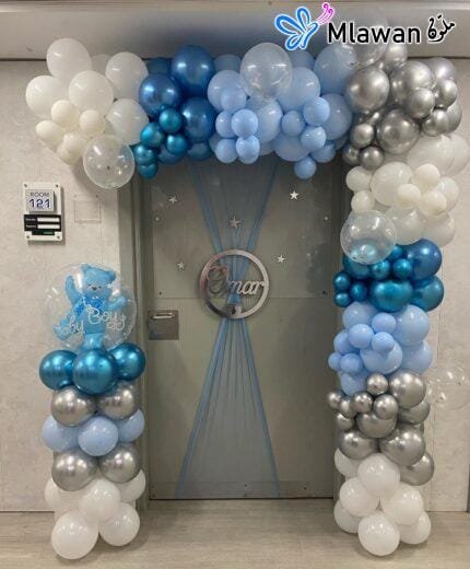 baby boy announcement decor with balloons and custom plaque
