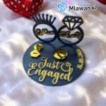 Wedding Ring Stand with Just Engaged" text and personalized names