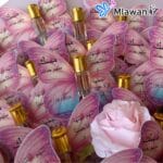 Personalized wedding favor in butterfly shape with musk perfume and pink gradient design