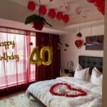 Anniversary room decor with candles and flower petals