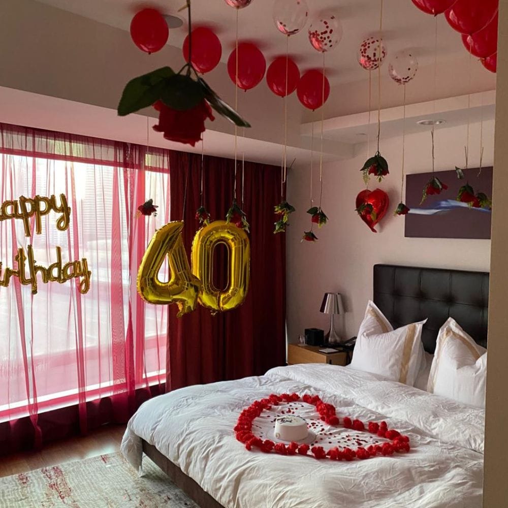 Anniversary room decor with candles and flower petals Anniversary room decor with candles and flower petals