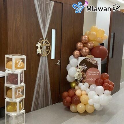 Hospital room setup with teddy-themed door sign and balloons
