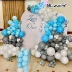 Custom balloon setup with photo backdrop for birthday event