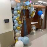 Balloon arch and door décor setup for baby welcome at Mediclinic