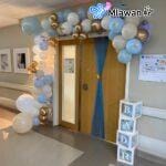 Personalized newborn door sign with balloons for hospital decor