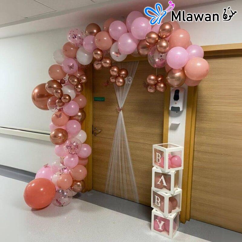 hospital room decoration for newborn baby boy featuring arc balloons and door signs