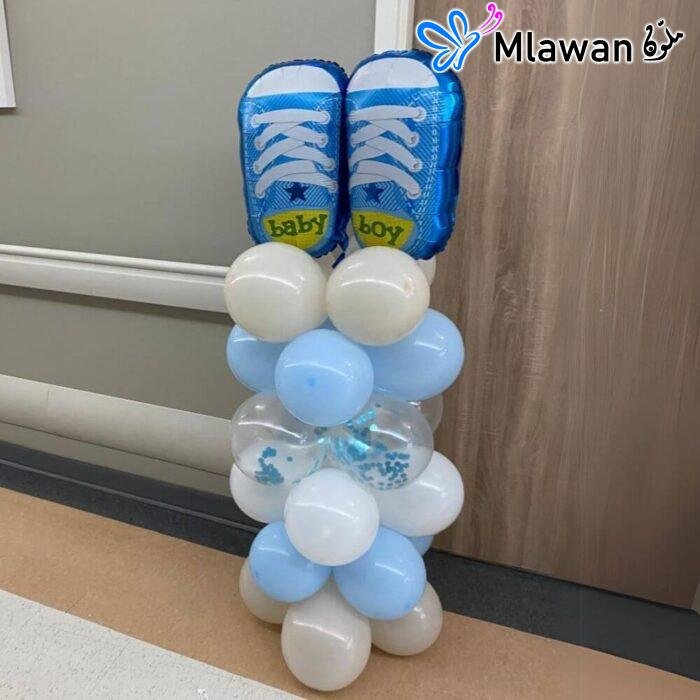 Vibrant balloon columns transforming hospital room for newborn celebration