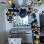 Helium-filled birthday and newborn balloon setup in Dubai