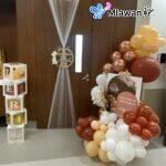 Baby-themed balloon easel and name boxes at hospital entrance