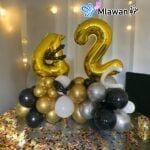 Gold number balloon arrangement for milestone birthday