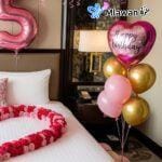 Romantic room decor Hotel room surprise Anniversary staycation ideas.