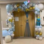 newborn hospital room decoration with balloon arch and custom name sign