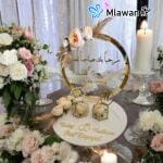Elegant gold-accented engagement ring display "ستاند محابس بليكسي"