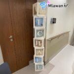 Beautiful baby room decoration with soft pastel balloons and drapes