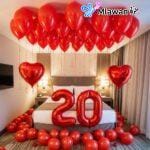 Romantic Dubai hotel room red balloons and hearts.