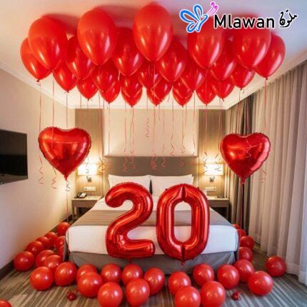 Romantic Dubai hotel room red balloons and hearts.