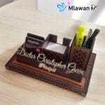 Multifunctional desk organizer with compartments for pens and notes.