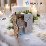 Elegant wooden wedding gift box with engraved names.