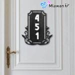 Durable vertical house number plate for villa entrance.
