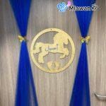 Newborn door decoration with chiffon drapes and balloons.