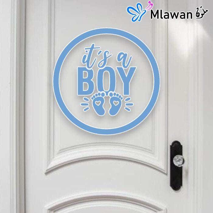 door sign with "It's a Boy" text and footprints