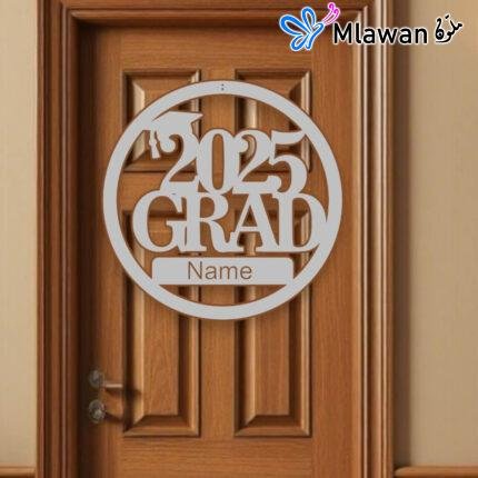 Silver, gold, and black graduation door sign with “Congrats Grad” text
