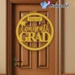 graduation plaque hanging on a decorated front door
