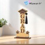Custom graduation trophy engraved with student name and university logo