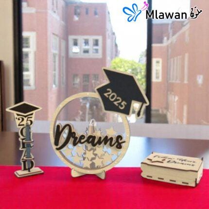 Graduation guest book with pen holder and wooden star name tags displayed on a table