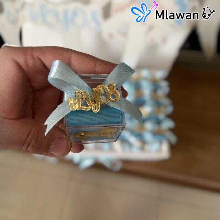 Here are a few options for the alt text, keeping in mind the requirements:* توزيعات مواليد شوكولاتة علب اكريليك هدايا فريدة* توزيعات مواليد شوكولاتة - Personalized Acrylic Name Tags For Baby Shower Chocolate Box Mini Giveaways* توزيعات مواليد هدايا استقبال مولود علب اكريليك* شوكولاتة توزيعات مواليد هدايا استقبال فريدة* علب اكريليك مواليد توزيعات شوكولاتة فريدة