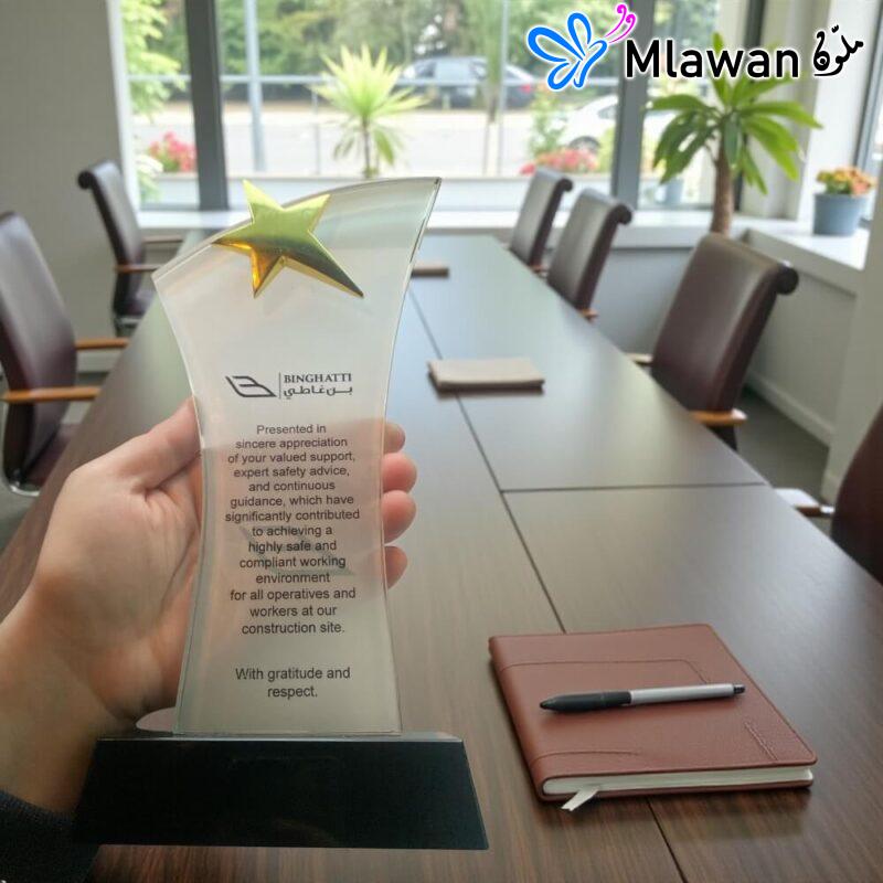 Crystal trophy golden star black base.