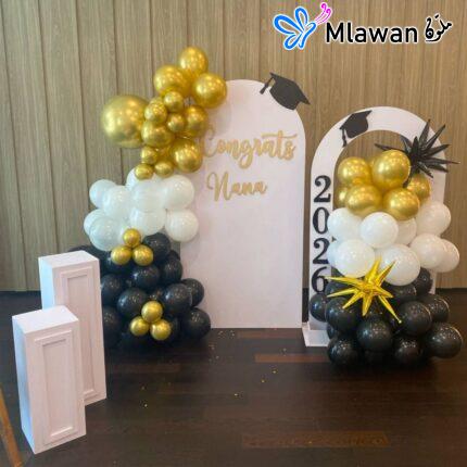 Graduation balloon arch with gold white black decor