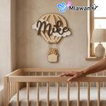 Personalized wooden hot air balloon name sign with bear accent.