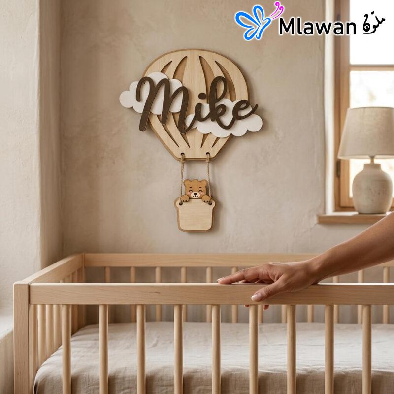 Personalized wooden hot air balloon name sign with bear accent.