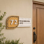 Modern curved wooden house number sign with name