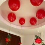 Romantic room decor with hanging flowers and balloons for a special occasion