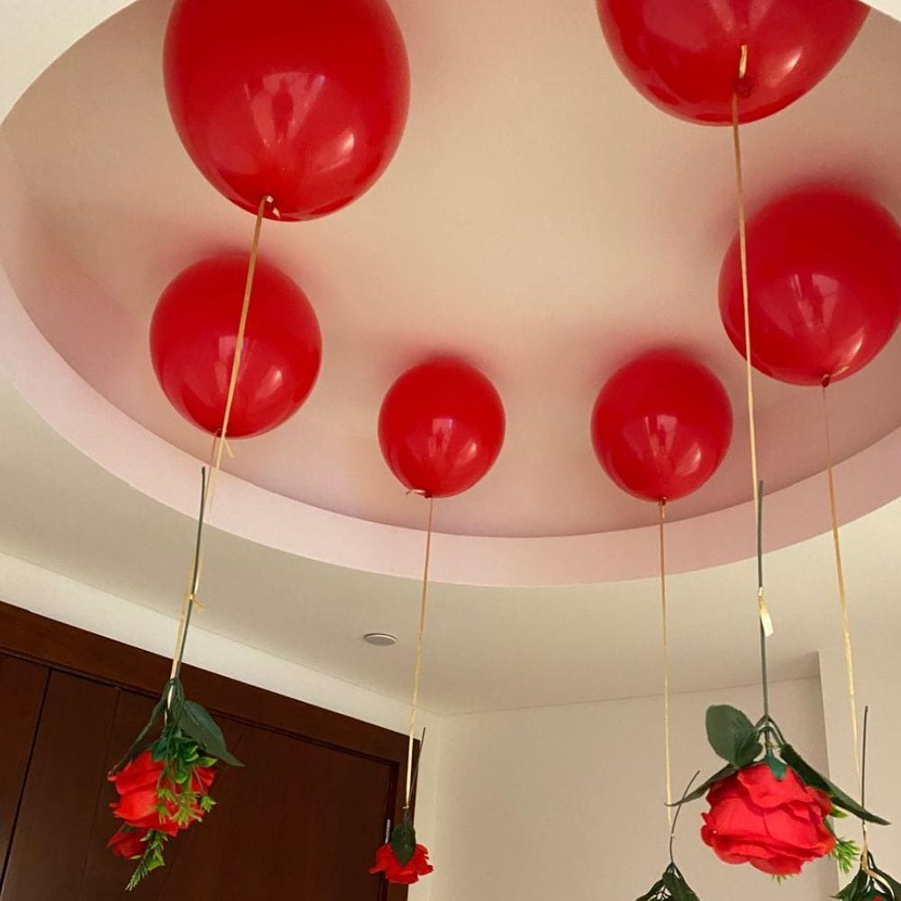 Romantic room decor with hanging flowers and balloons for a special occasion Romantic room decor with hanging flowers and balloons for a special occasion