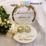 Personalized engagement table decor with Arabic calligraphy and hexagon ring holders