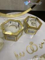 Custom engagement decor with hexagon ring holders for rings